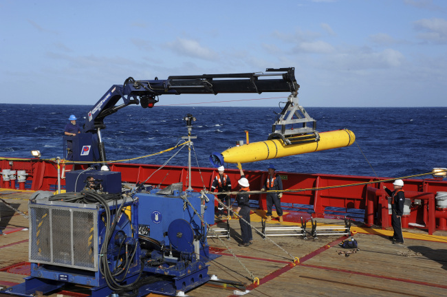 The Bluefin 21 autonomous sub is hoisted back on board the Australian Defense Vessel Ocean Shield after successful buoyancy testing in the Indian Ocean, as search efforts continue for missing Malaysia Airlines Flight 370.   AP-Yonhap