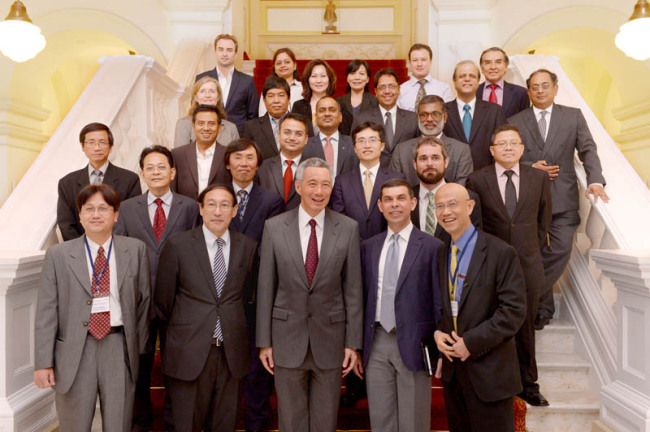 Singapore Prime Minister Lee Hsien Loong (center, front row), poses with editors of the Asia News Network at the Istana on April 8.   ANN