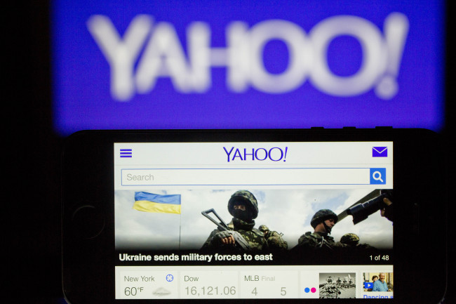 The Yahoo! Inc. website and logo is displayed on an Apple Inc. iPhone 5s and laptop computer in this arranged photograph in Washington, D.C., U.S., on Tuesday, April 15, 2014. Yahoo! Inc. expected to release earnings figures after the market close on April 15. Photographer: Andrew Harrer/Bloomberg
Yahoo’s website   Bloomberg
Yahoo’s website   Bloomberg
