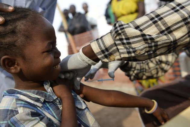 A child receives a vaccine in a clinic of the Doctors Without Borders organization during a vaccination program against measles in Bangui.   AFP