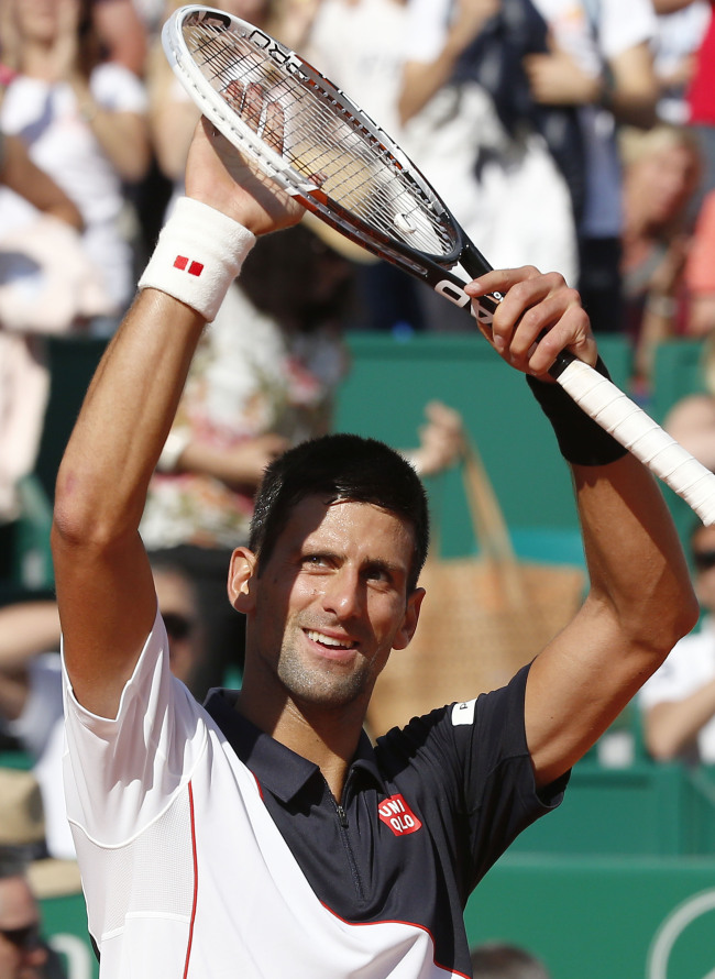 Novak Djokovic acknowledges applause after defeating Pablo Carreno Busta during their third-round match of the Monte Carlo Tennis Masters tournament in Monaco on Thursday.   AP-Yonhap