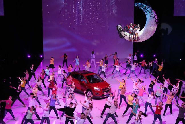 Dancers perform around a new Chevrolet Trax car during the “Chevrolet Gala Night,” ahead of the Beijing International Automotive Exhibition in Beijing.   AFP-Yonhap