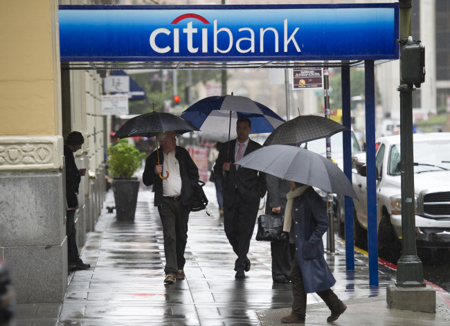 Pedestrians walk in front of a Citigroup Inc. bank branch in San Francisco, California.   Bloomberg