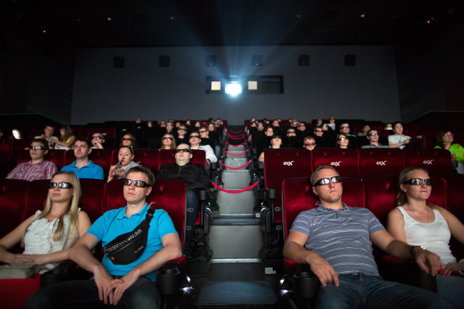 Audience members wear 3-D glasses to watch a movie using 4DX motion picture technology at a theater in Moscow.   Bloomberg