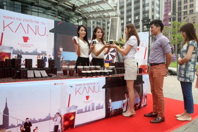 Citizens stand in line for a taste of the instant coffee Kanu in Gwanghwamun, Seoul.   Dong Suh Foods