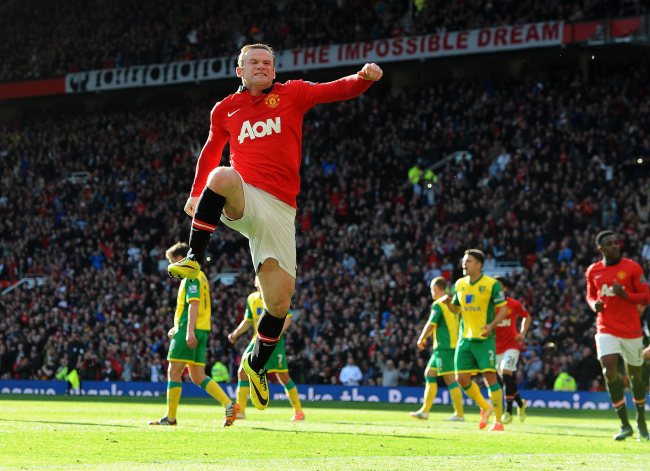 Manchester United’s Wayne Rooney celebrates after scoring on Saturday.   EPA-Yonhap