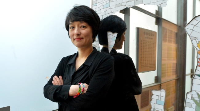 Moon Young-me poses for a photo prior to an interview with The Korea Herald on Thursday.    Yoon Byung-chan/The Korea Herald