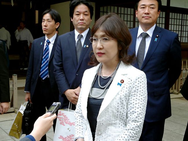 Tomomi Inada, Japanese state minister in charge of administrative reform, speaks to reporters after visiting the Yasukuni Shrine in Tokyo on Monday.   AFP-Yonhap