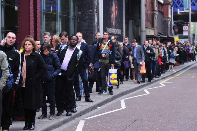 Commuters line up for buses outside Waterloo Station in London on Tuesday.   AFP-Yonhap