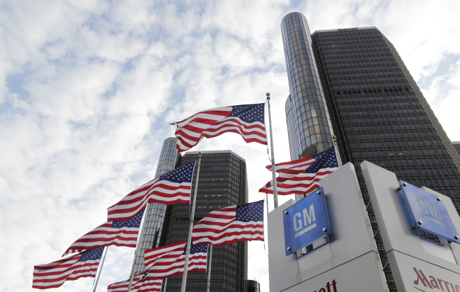 Flags fly outside General Motors Co. world headquarters in Detroit, Michigan.   Bloomberg