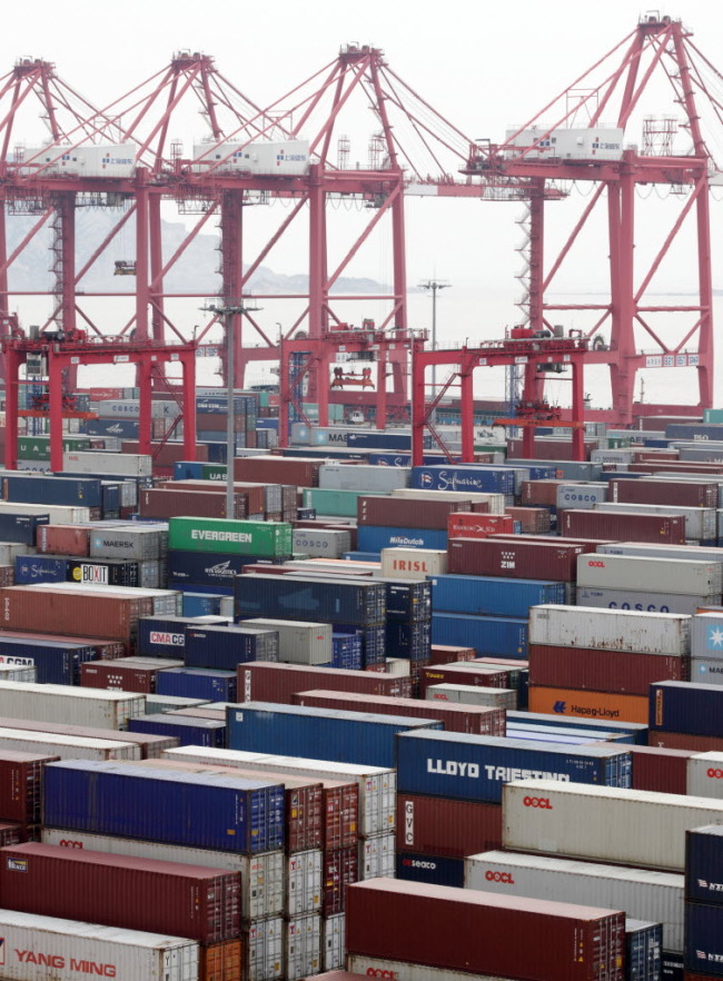 Shipping containers are stacked at the Yangshan Deep Water Port in ShanghaI.   Bloomberg