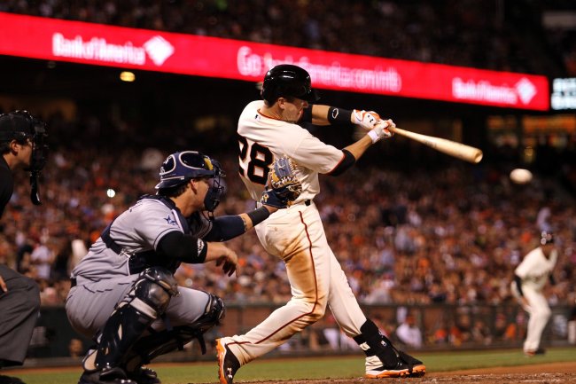 The San Francisco Giants’ Buster Posey connects an RBI single against the San Diego Padres in San Francisco, California, Wednesday.   MCT