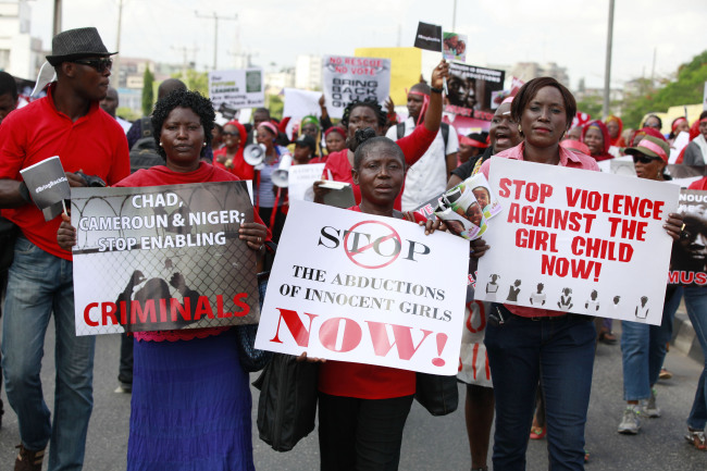 Women attend a demonstration calling on the government to rescue kidnapped school girls in Lagos, Nigeria, Monday.   AP-Yonhap