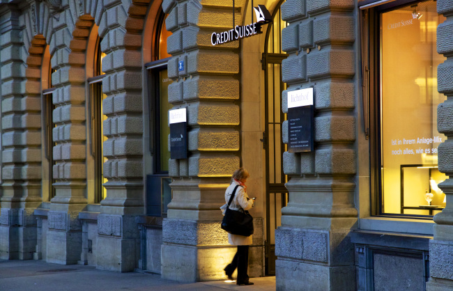 A visitor enters the Credit Suisse Group AG headquarters in Zurich, Switzerland.   Bloomberg
