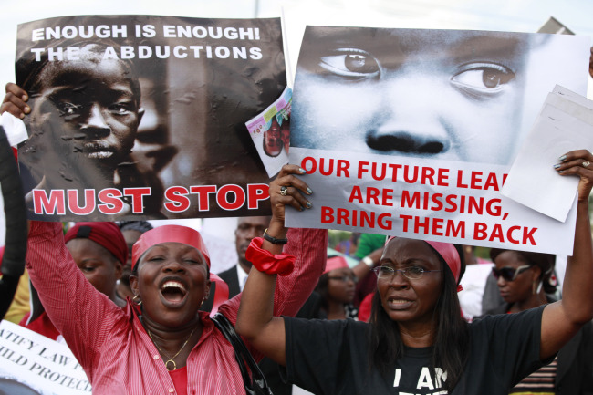 Women attend a demonstration calling on the government to rescue kidnapped school girls of a government secondary school Chibok in Lagos, Nigeria, Monday.   AP-Yonhap