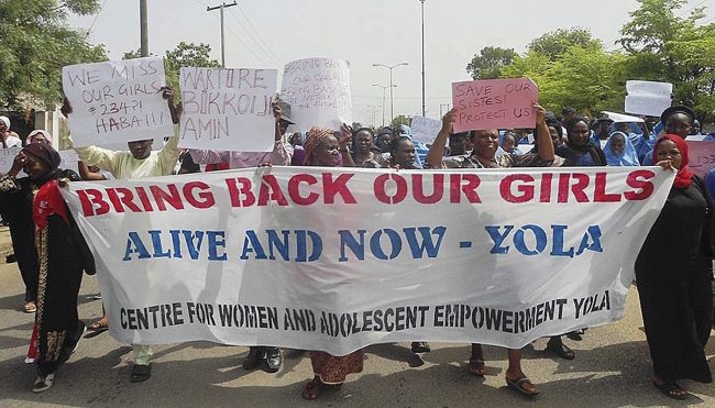 Nigerians protest the government’s failure to rescue the abducted Chibok schoolgirls in Yola, Nigeria, Thursday.   EPA-Yonhap