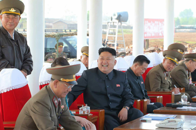 North Korean leader Kim Jong-un (center) attends an Air Force event on Saturday in a photo released by the Rodong Sinmun, a mouthpiece of the ruling Workers’ Party, which shows Choe Ryong-hae (third from left), former director of the General Political Bureau of the Korean People’s Army, sitting next to Kim.   Yonhap