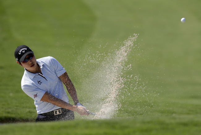 Bae Sang-moon hits out of a bunker onto the third green during the Byron Nelson Championship in Irving, Texas, Thursday. AP-Yonhap