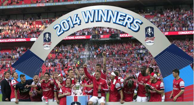 Arsenal players celebrate after winning the English FA Cup in London on Saturday.   AFP-Yonhap
