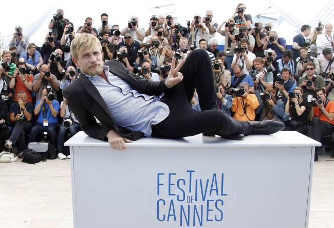 Belgian actor Jeremie Renier poses during a photo call for the film “Saint-Laurent” at the 67th edition of the Cannes Film Festival in Cannes, southern France, Saturday.   AFP-Yonhap
