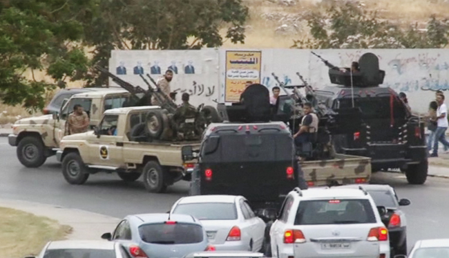 Vehicles with heavy artillery of the Tripoli joint security forces head to the parliament building after troops of Gen. Khalifa Hifter targeted Islamist lawmakers and officials at the parliament in Tripoli on Sunday.
AP-Yonhap