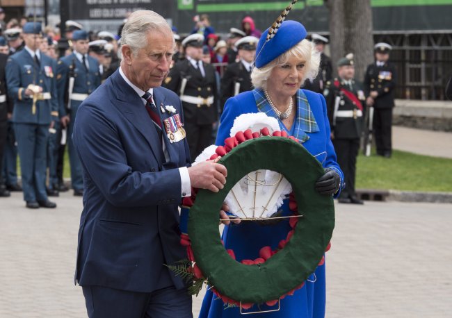 Prince Charles and his wife Camilla, The Duchess of Cornwall, lay a wreath during welcoming ceremonies in Halifax, Nova Scotia, Monday.   AP-Yonhap