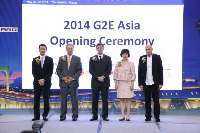 The Non-Gaming Executive Exhibition Association, aiming to diversify Macau’s casino-focused industry, kicked off on Tuesday at the Global Gaming Expo Asia 2014 opening ceremony. From left: Michael Mecca, president and CEO of Galaxy Entertainment Group; Ted Chan, CEO of Melco Crown Entertainment; Geoff Freeman, president and CEO of the American Gaming Association; Pansy Ho, cochairperson and executive director of MGM China Holdings; and Allan Zeman, chairman and founder of Lan Kwai Fong Concepts.   G2E Asia
