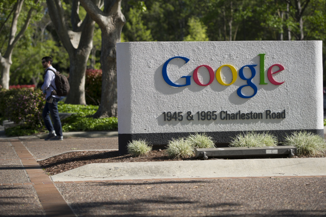 A pedestrian walks outside Google’s headquarters in Mountain View, California.   Bloomberg