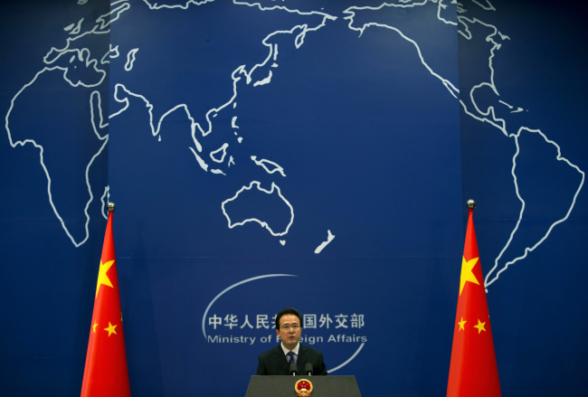Chinese Foreign Ministry spokesman Hong Lei speaks during a daily briefing at the Ministry of Foreign Affairs office in Beijing, Tuesday.  AP-Yonhap