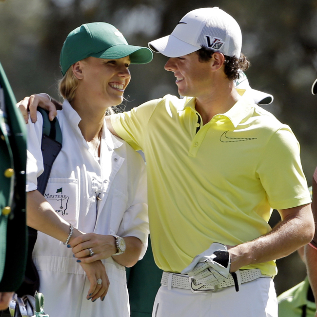 Rory McIlroy (right) hugs Caroline Wozniacki during the Masters golf tournament in Augusta, Georgia, April 10.   AP-Yonhap