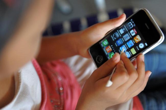 The World Health Organization has called for research into the effects of mobile phone use on young people.   AFP