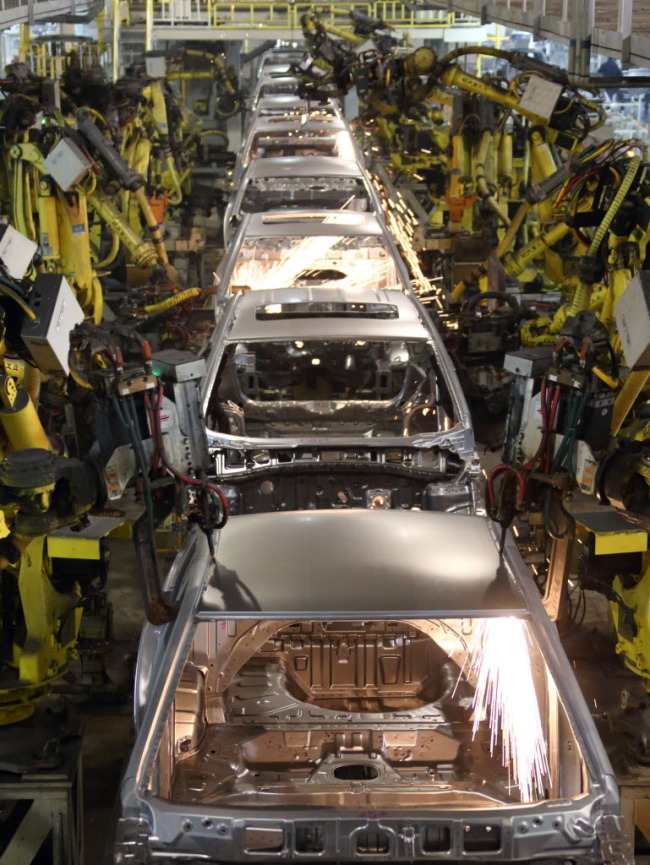 Robots work on the welding line at a Hyundai Motor Co. plant in  Beijing.   Bloomberg