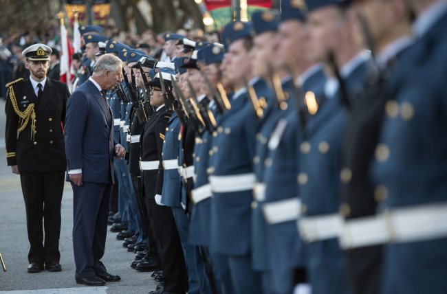 Prince Charles inspects an honor guard during a farewell ceremony in front of the Manitoba Legislature in Winnipeg, Canada, Wednesday.   AP-Yonhap