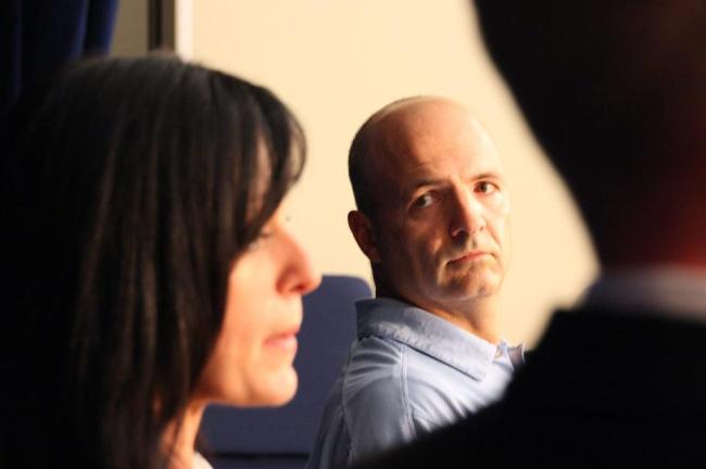 In this Oct. 31, 2010, file photo, Tabitha Speer (left), widow of Sgt. 1st Class Chris Speer, who was killed by a hand grenade that Omar Khadr admitted throwing, speaks to reporters on the sentencing of Khadr at his military commission at Guantanamo Bay, Cuba, as former sergeant Layne Morris, blinded in one eye by shrapnel during the firefight where Khadr was captured, looks on.  AFP