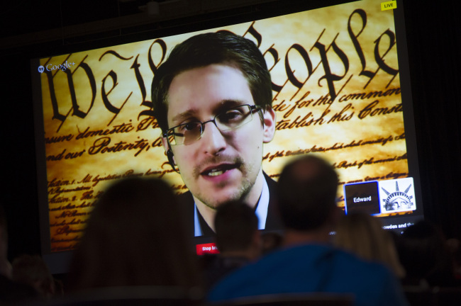 Edward Snowden, the former National Security Agency contractor, speaks on screen during a virtual conversation at a featured session at the South By Southwest Interactive Festival in Austin, Texas, in March.   Bloomberg