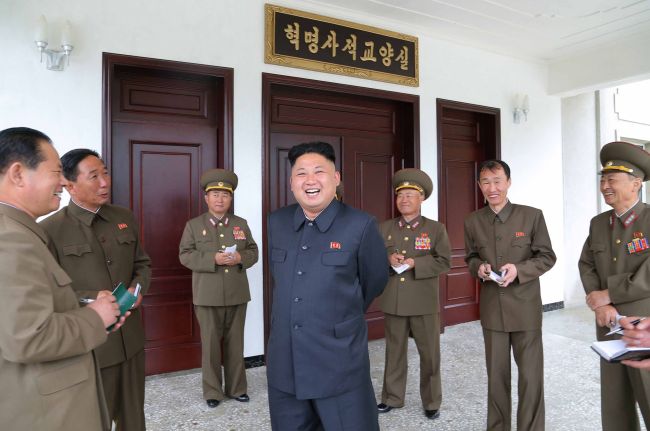 This undated picture released by the (North) Korean Central News Agency shows leader Kim Jong-un inspecting the Taegwan Glass Factory in Taegwan, North Pyeongan Province.   Yonhap
