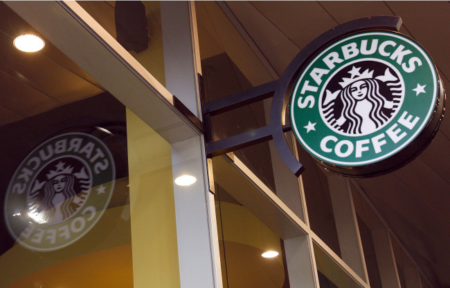 The logo for Starbucks Corp. is displayed in Melbourne, Australia.   Bloomberg