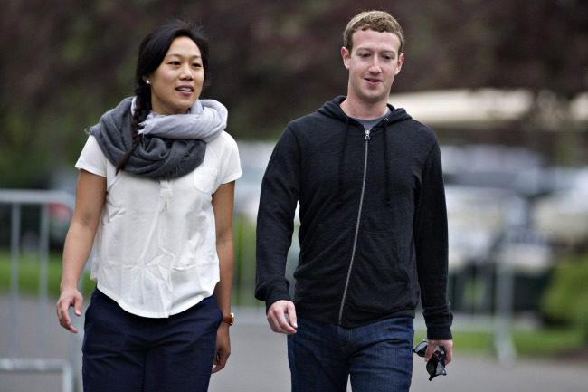 Facebook CEO Mark Zuckerberg (right) and his wife Priscilla Chan.   Bloomberg