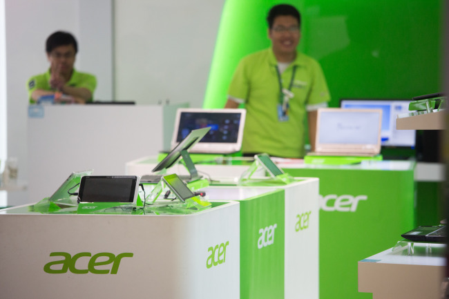 Acer Inc. products are displayed for sale inside an electronics store in Taipei.   Bloomberg