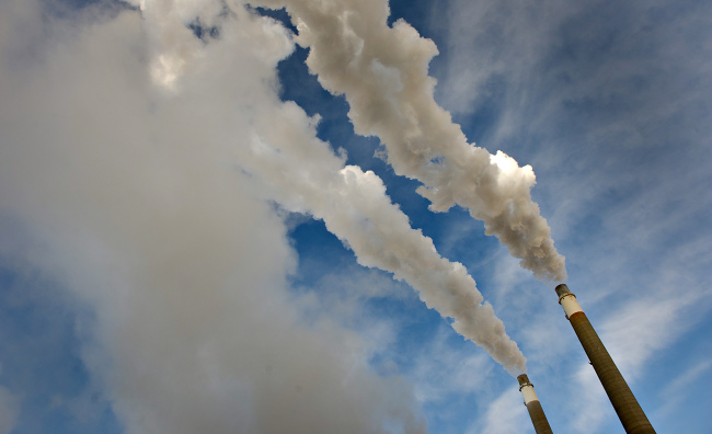 Steam rises from exhaust stacks at the Great River Energy Coal Creek Station coal-fueled power plant in Underwood, North Dakota.    Bloomberg