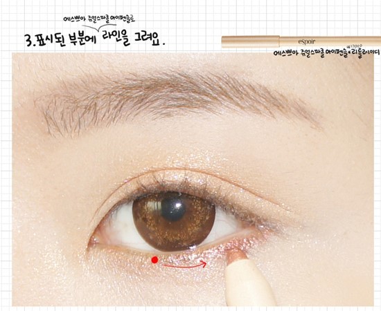 Choose a pinkish-gold eye pencil and apply it on 1/2 of your lower eyelid.