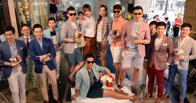 Models on Sunday pose during a fashion show at Lotte Department Store in Seoul, promoting “cool-biz” attire, or summer work wear for men.   Ahn Hoon/The Korea Herald