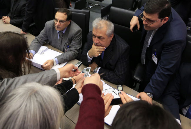 Iraqi Oil Minister Abdul Kareem al-Luaibi (center) answers questions at the 164th meeting of the Organization of Petroleum Exporting Countries conference in Vienna on Dec. 4, 2013.   AFP