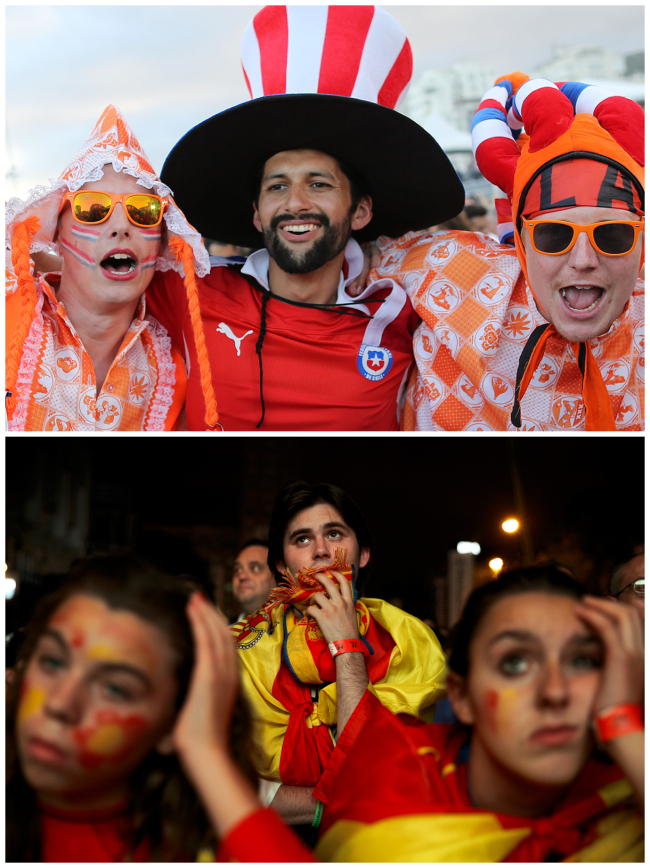 In this combination of Associated Press photos Dutch soccer fans, top, pose for a photo inside the FIFA Fan Fest area on Copacabana beach in Rio de Janeiro, Brazil, and Spanish soccer fans, bottom, in Madrid, watch on a giant display as the Netherlands defeat Spain during a World Cup soccer match Friday. (AP-Yonhap)