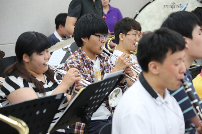 Trumpet player Lee Han-gyeol (center) performs as a member of Heart to Heart Orchestra, the first non-profit orchestra for young people with developmental disabilities in South Korea.   Heart to Heart Foundation