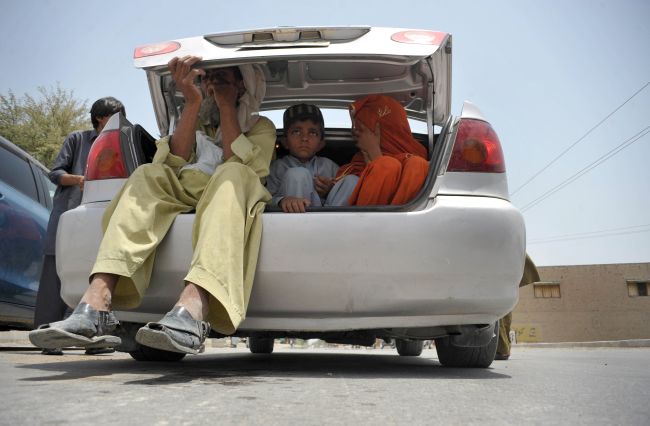 Civilians, fleeing from a military operation in the North Waziristan tribal area, arrive in Bannu district in Pakistan on Wednesday.   AFP-Yonhap