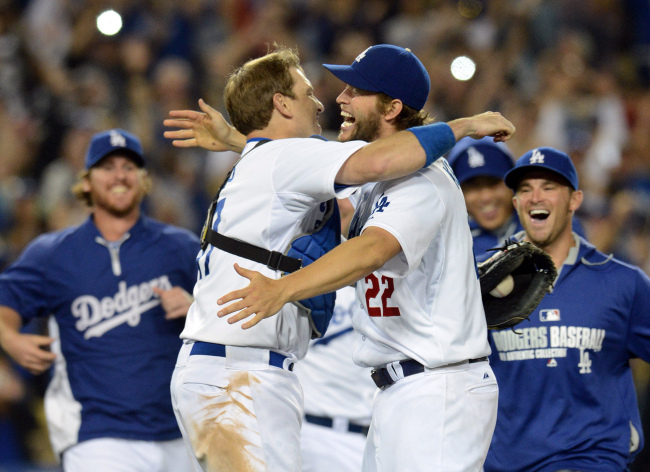 Los Angeles Dodgers starting pitcher Clayton Kershaw (right) celebrates with catcher A.J. Ellis after the final out in Los Angeles on Wednesday.   USA Today-Yonhap