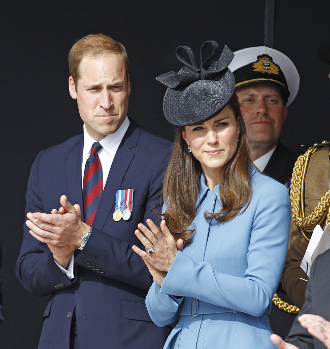 Britain’s Prince William, Duke of Cambridge, and Kate, the Duchess of Cambridge, applaud as they attend a remembrance ceremony in Arromanches, France, on June 6.   AP-Yonhap