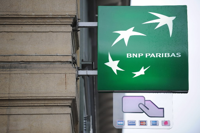 A BNP Paribas sign hangs outside a branch in Paris.    Bloomberg