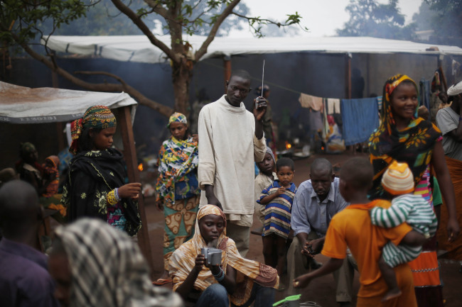 Muslim refugees listen to a radio at the Catholic church in Carnot, Central African Republic.   AP-Yonhap